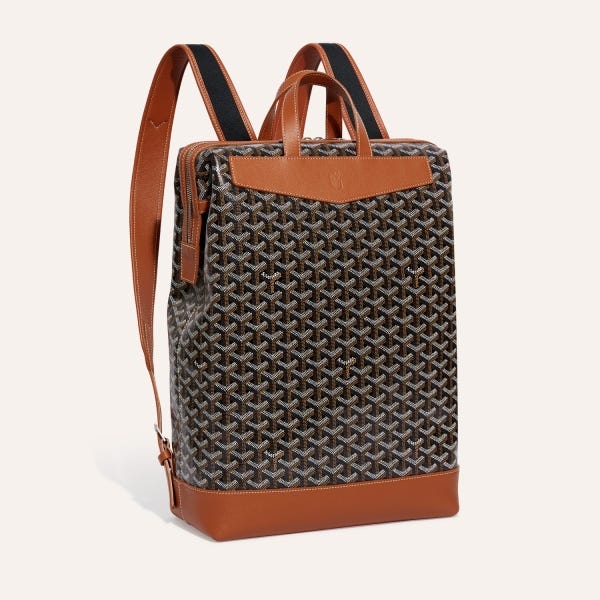 Black and tan Goyard Cisalpin backpack showing the tall zip-top body