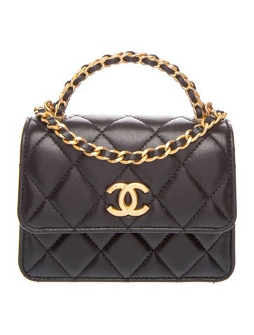 Mini lambskin top handle flap bag